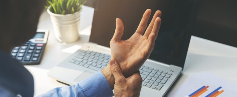 person holding sore wrist